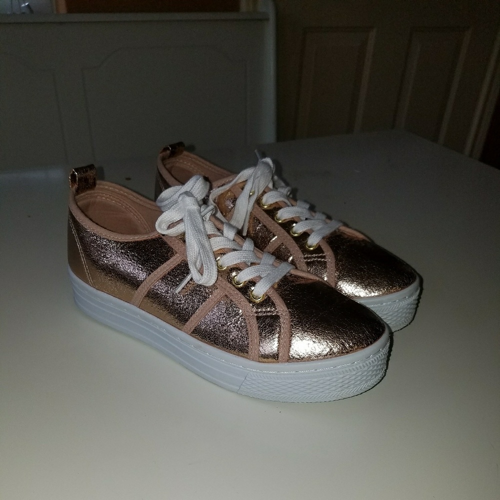 Metallic pair of tennis shoes
